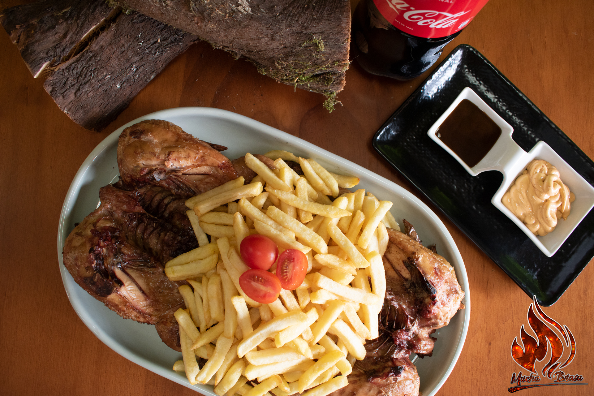 Dos pollos a la brasa, en horno de leña.